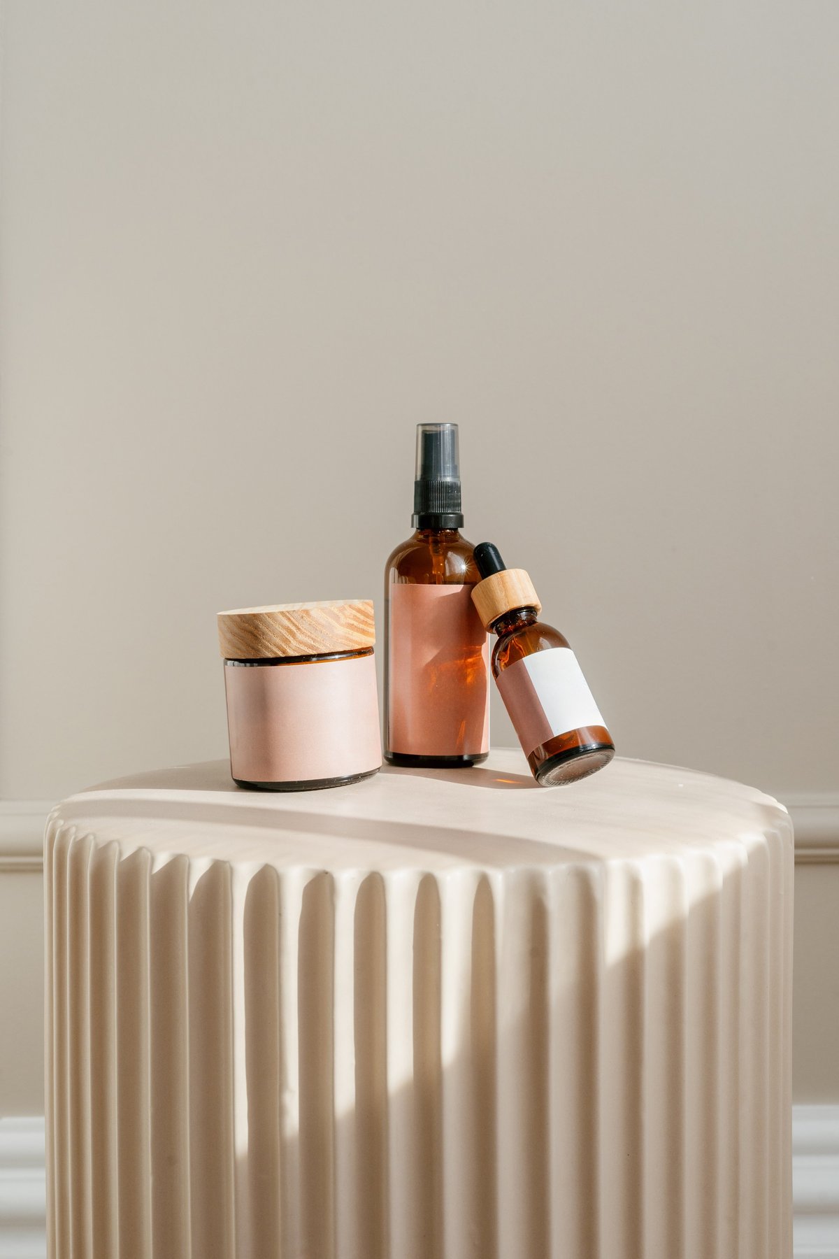 Beauty products on stylish pedestal — polished product photography