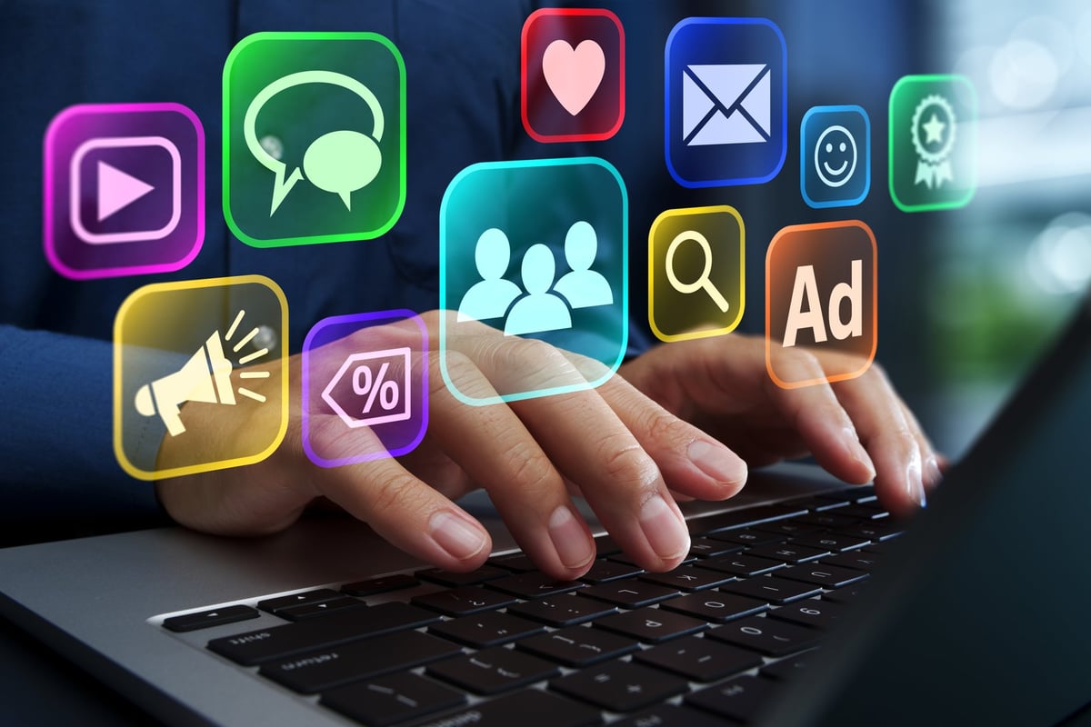 Businessperson using laptop for planning promotional campaign